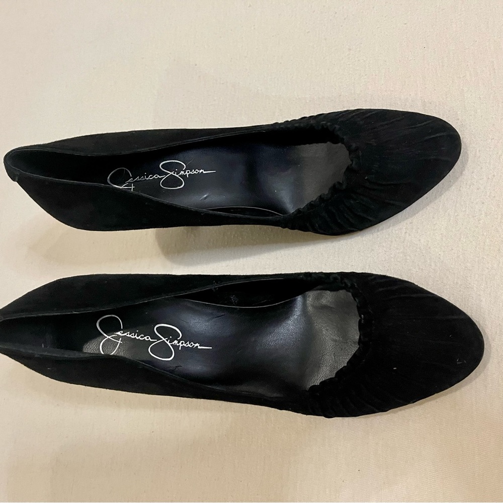 Black shade heels with gathering at top.